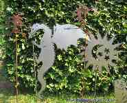 Garden stakes rising sheet steel dragon.