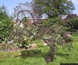 Wire horse garden Sculpture with peat and grass seed filled.